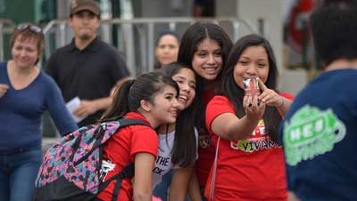 school kids taking selfies