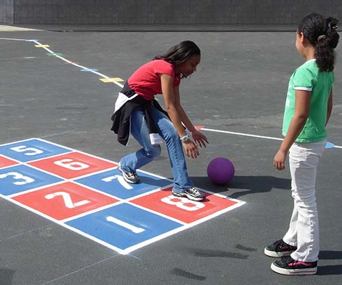 Grade school girls playing ball. Grade school girls playing ball.