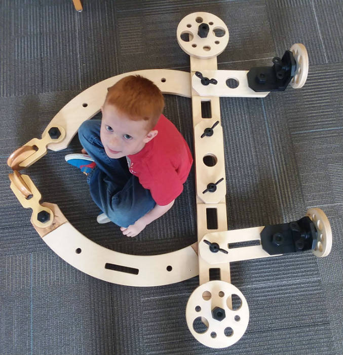 Boy sits in Airplane Rig Boy sits in Airplane Rig