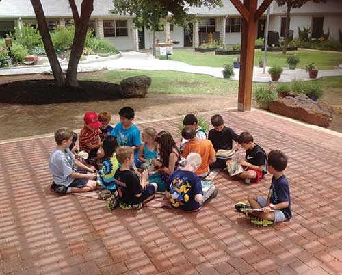 Children sitting on a patio Children sitting on a patio