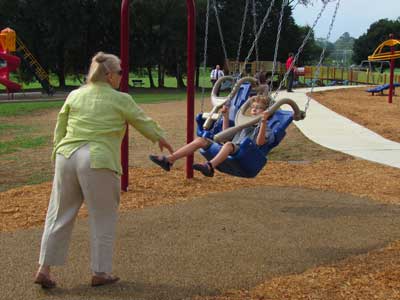 Grandmother with child in swing Grandmother with child in swing