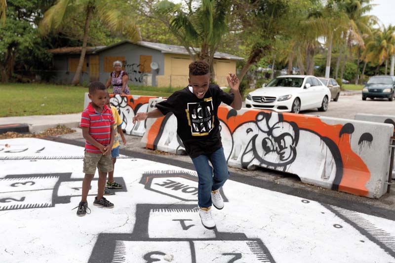 Child playing in dead end road Child playing in dead end road