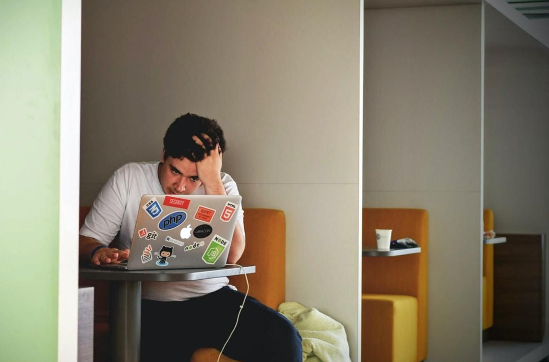 College student playing games on laptop College student playing games on laptop