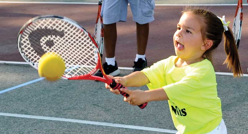 Girl playing tennis Girl playing tennis