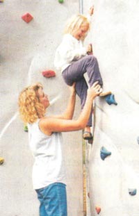 child climbing rock wall child climbing rock wall