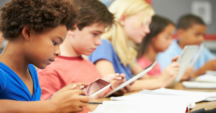Children using smartphones and tablets. Children using smartphones and tablets.