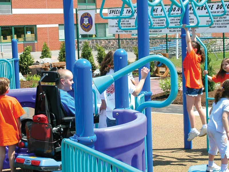 Kids on inclusive playground equipment Kids on inclusive playground equipment