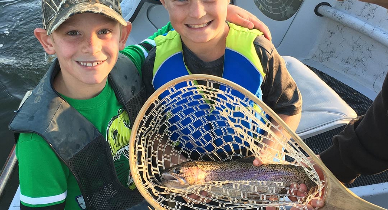 2 boys with a rainbow trout
