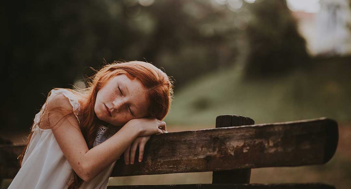 Young redhead girl feeling depressed 