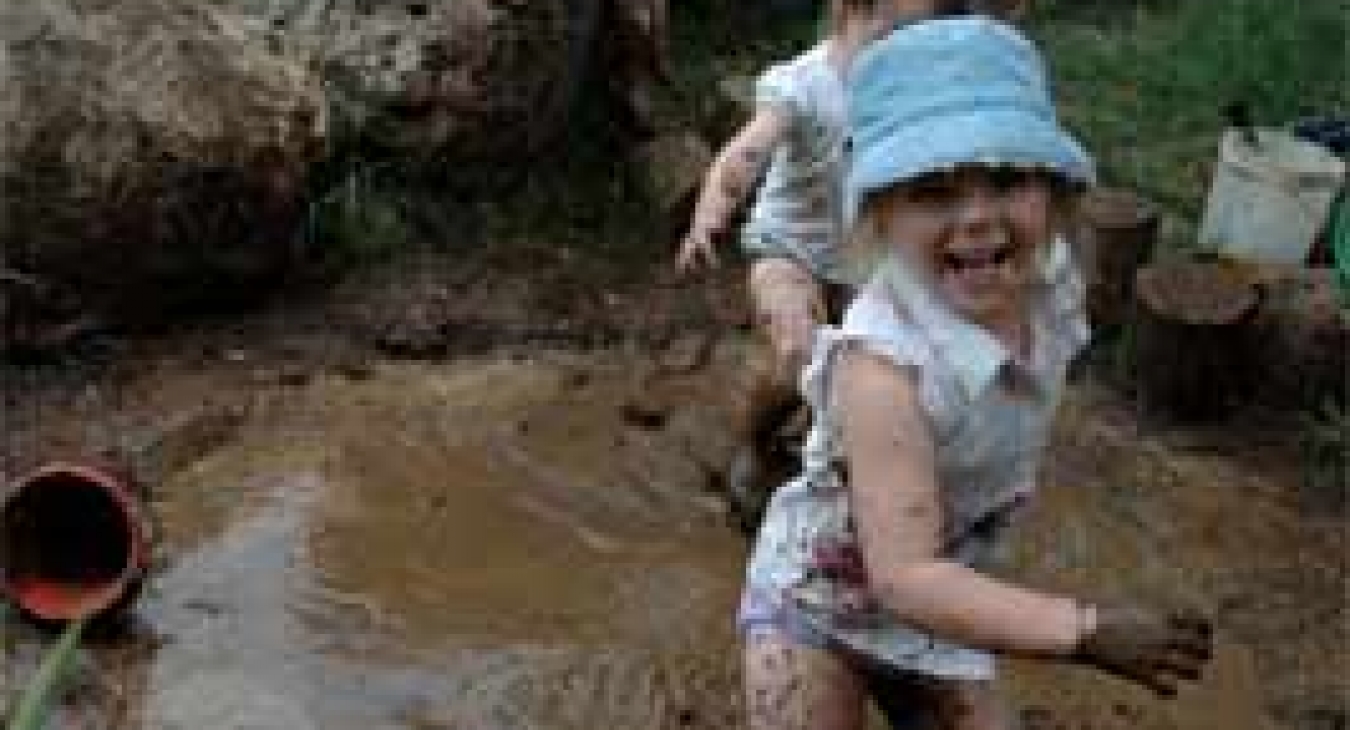 Playing in the mud at Open Spaces Preschool in Whangarei, New Zealand
