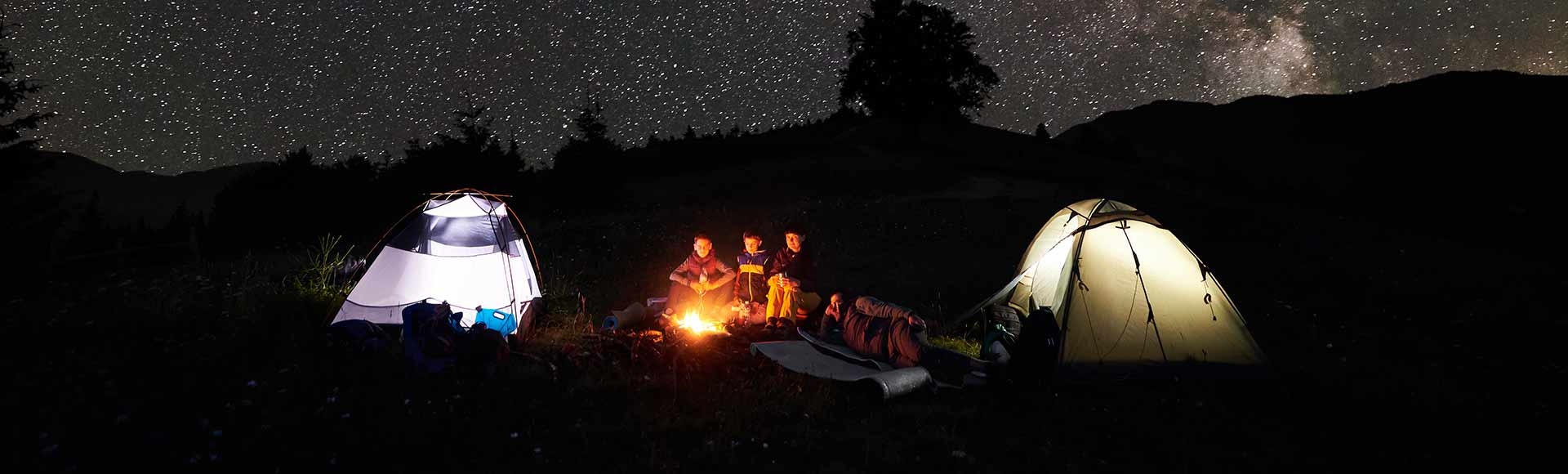 Family by the fire on a starry night